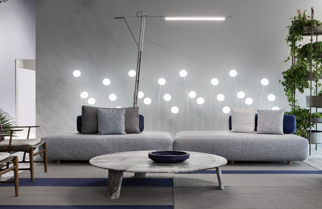 Round Biscuit Coffee Table and short legs in white and gray marble in a livig room.