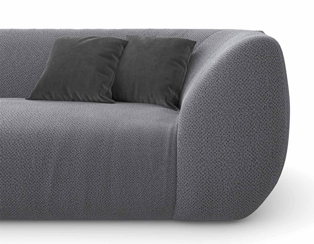 Closeup of Palau Sofa with armrest and backrest in gray on a white background.