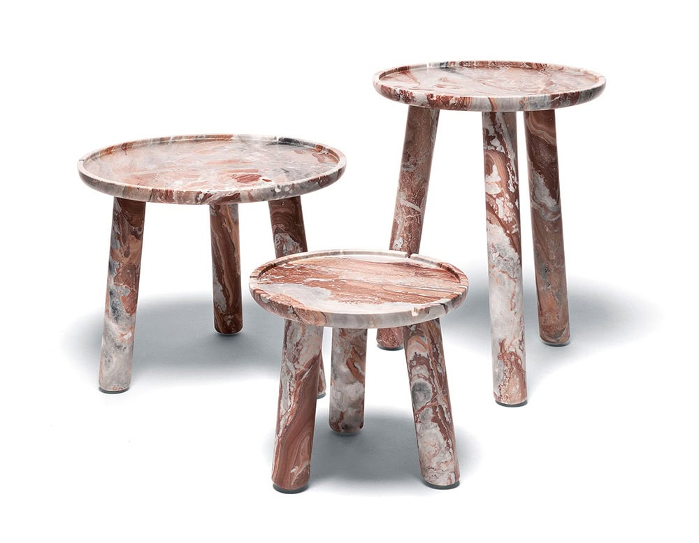 Three Stone Round Coffee Tables in gray and brown with three legs on a white background.