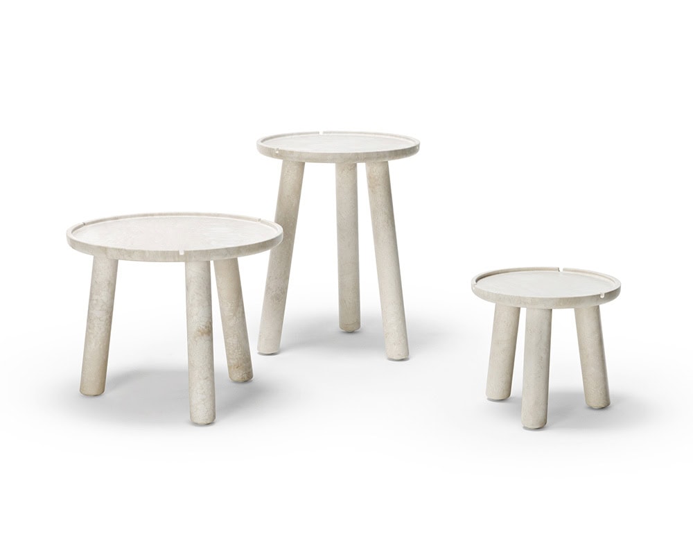 Three Stone Round Coffee tables in white with three legs on a white background.