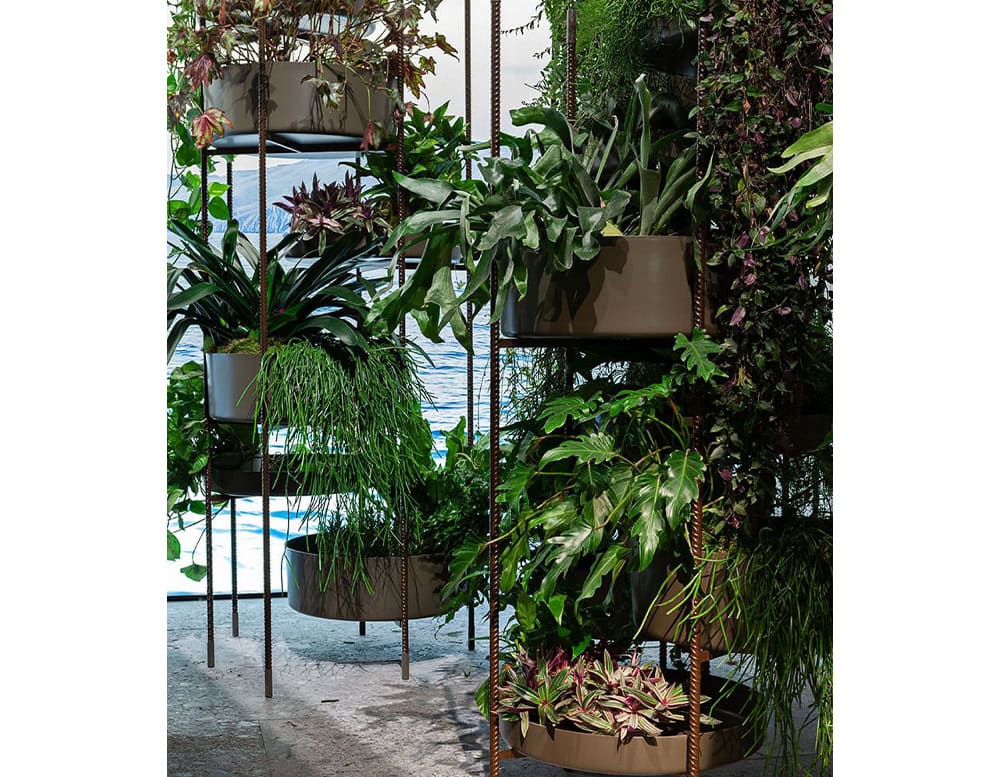 Two Brown Vertical Gardens made of five round modules on a white background.