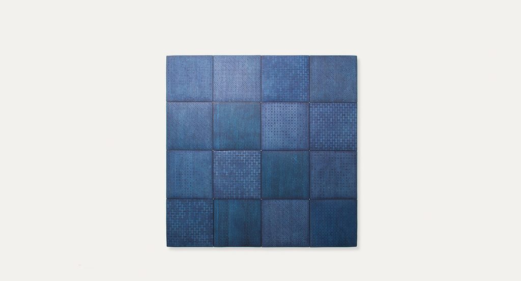 Ebanys rug made of blue square modules on a white background.