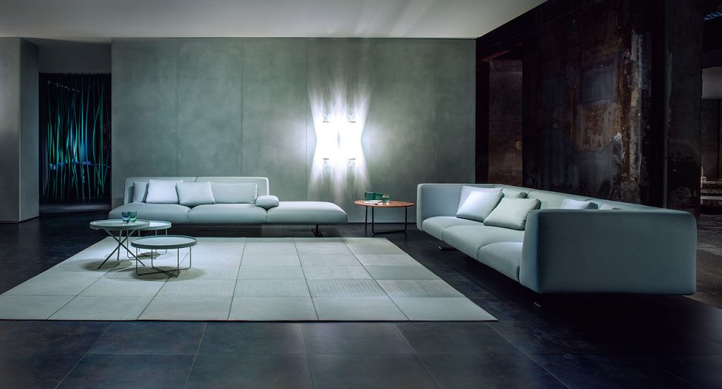 Ebanys rug made of grey square modules in a living room.