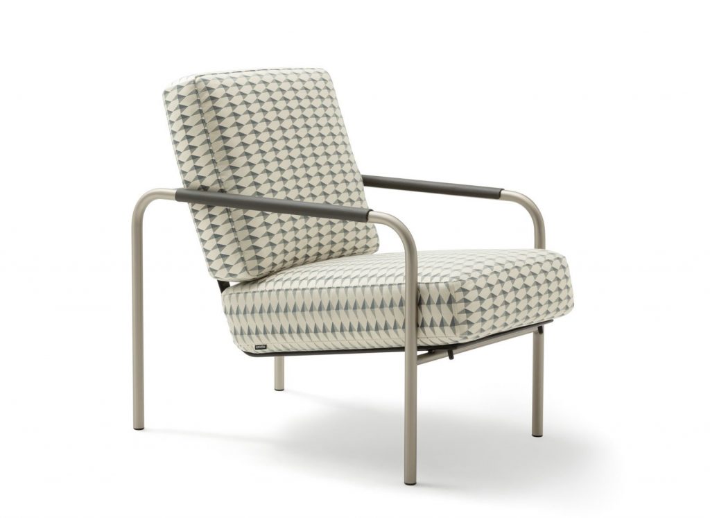 Susanna lounge chair with a sleek metal frame and gray triangle pattern cushioned seat and backrest on a white background.