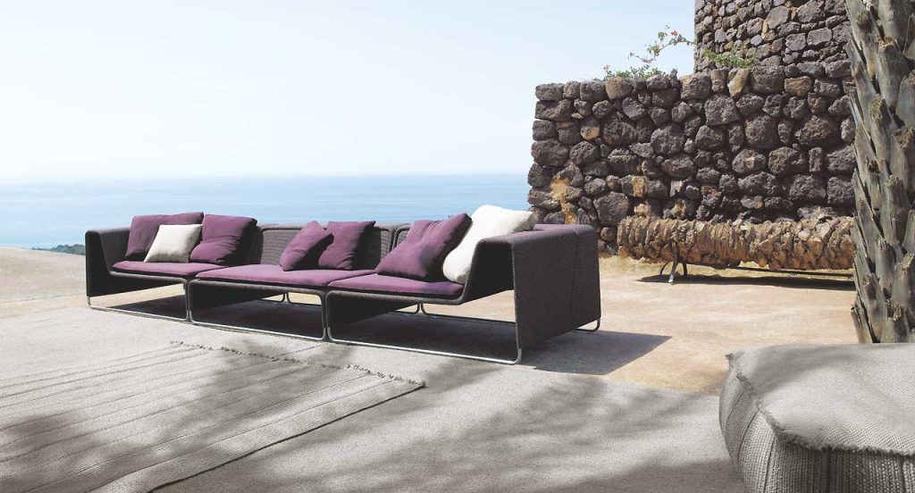 Three purple Island Sectionals, structure in steel, upholstery in white rope fabric in a terrace.