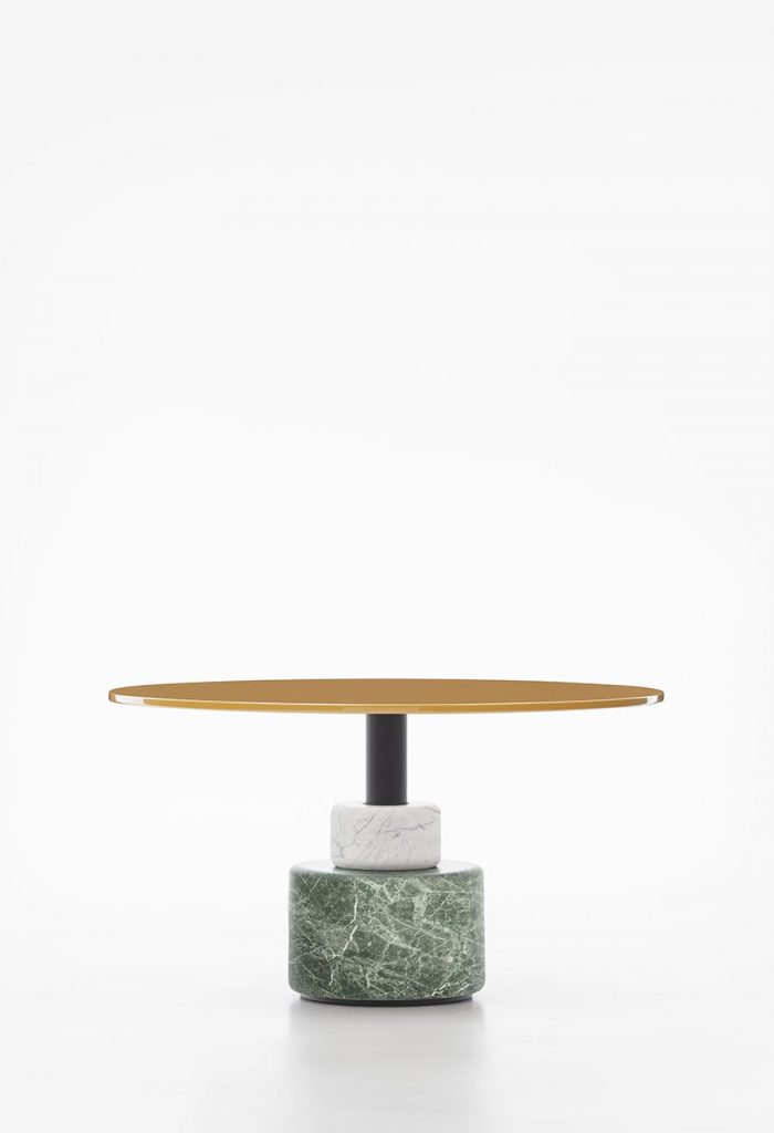 round table made of wood and resting on a marble base in a yellow and green tone on a white background