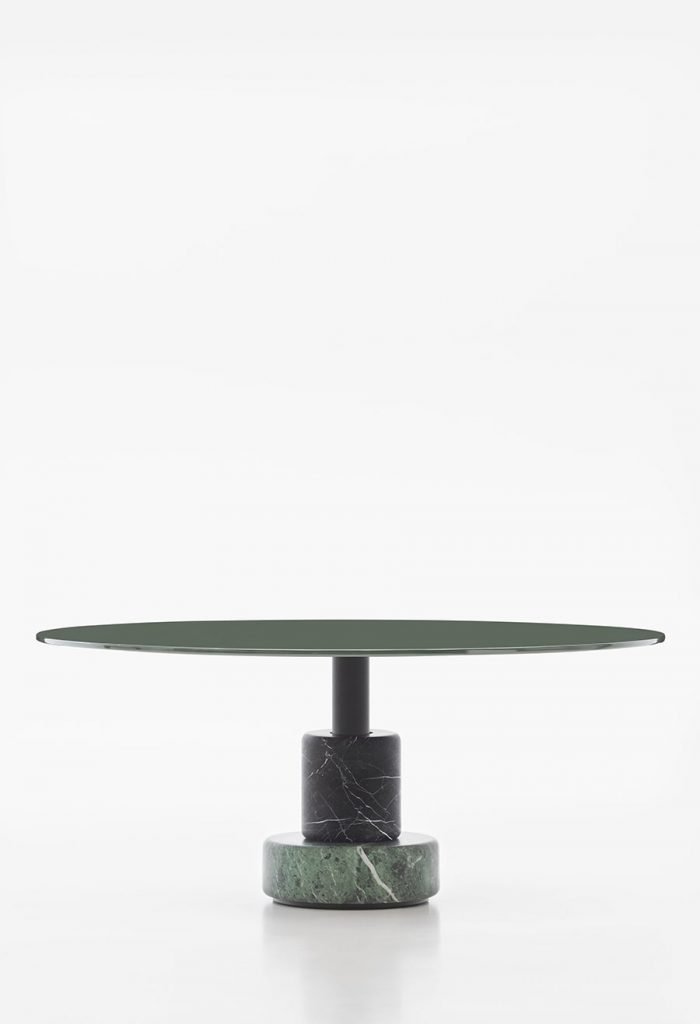 round table made of wood and resting on a marble base in a green tone on a white background