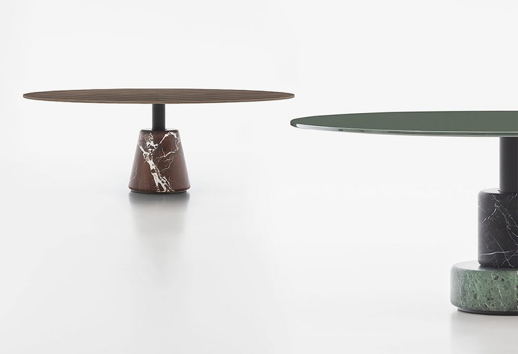 two tables made of marble base and round wooden top in a brown and green tone