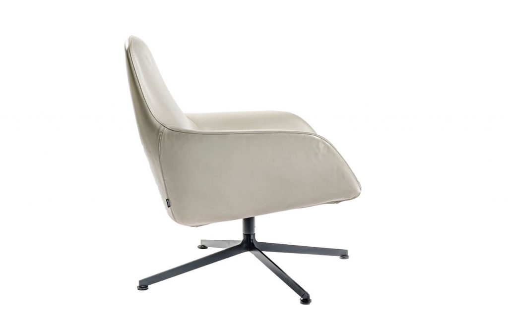 Side view of Kent armchair in front of a white background