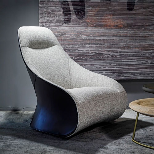 Armchair with mixed upholstery on a 360-degree swivel base in a tone of white with brown