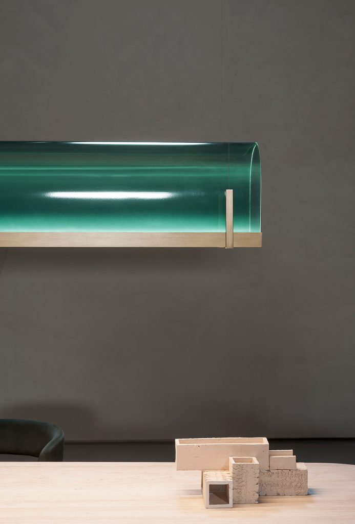 ceiling lamp made of glass in an emerald green tone and aluminum at the base in a gold tone