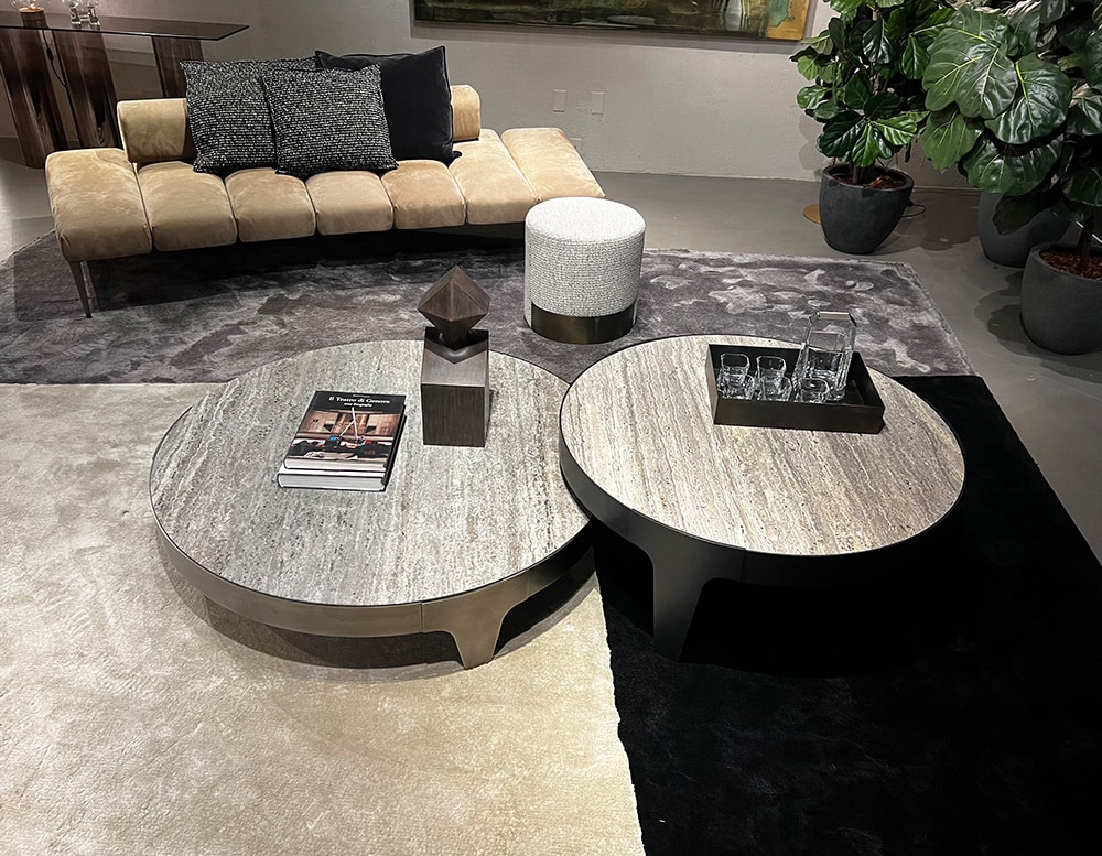 circular tables made of stone and steel with different shades of gray colorscircular tables made of stone and steel with different shades of gray colors.