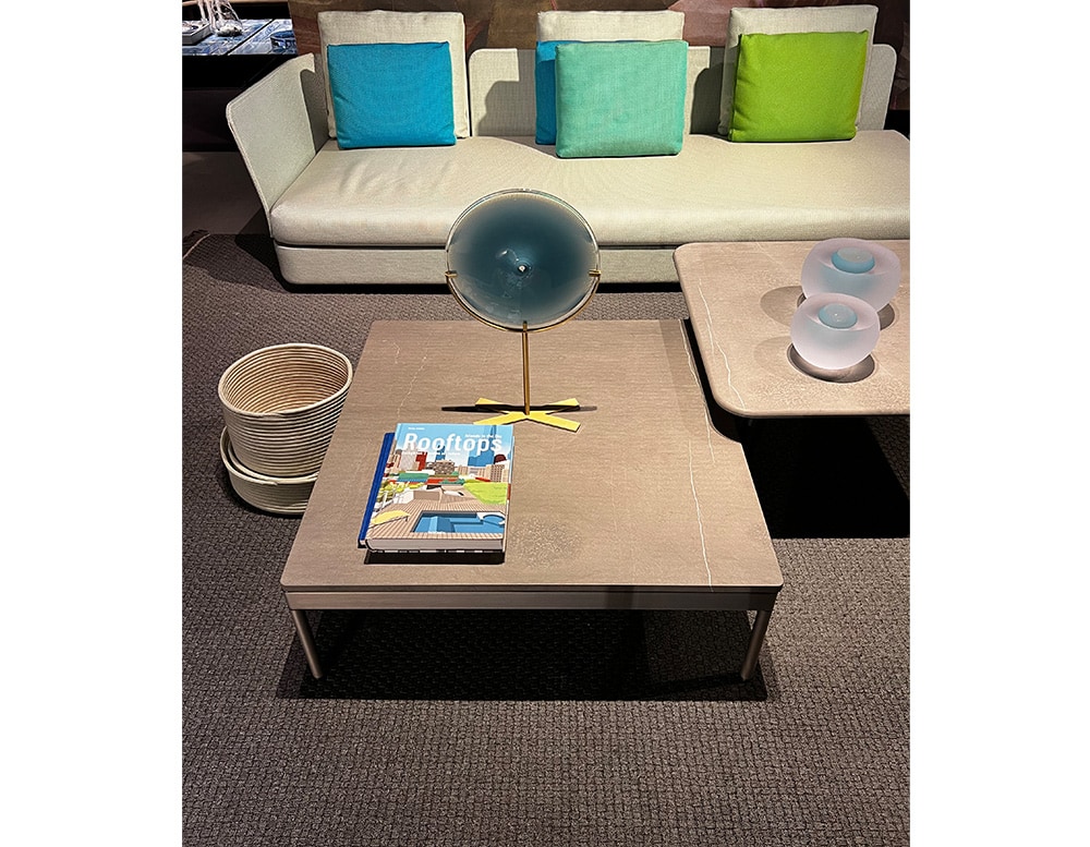 side table rolled in a light brown tone, made of stone and wood in a living room.