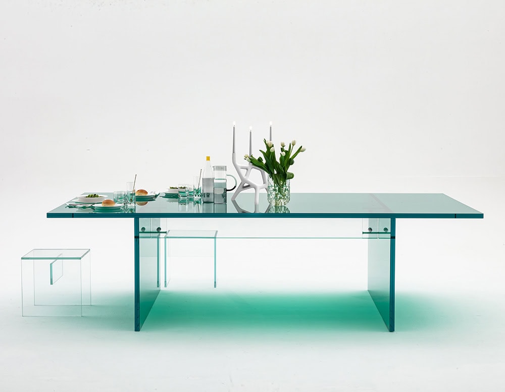 work table made entirely of thick transparent glass on a white background