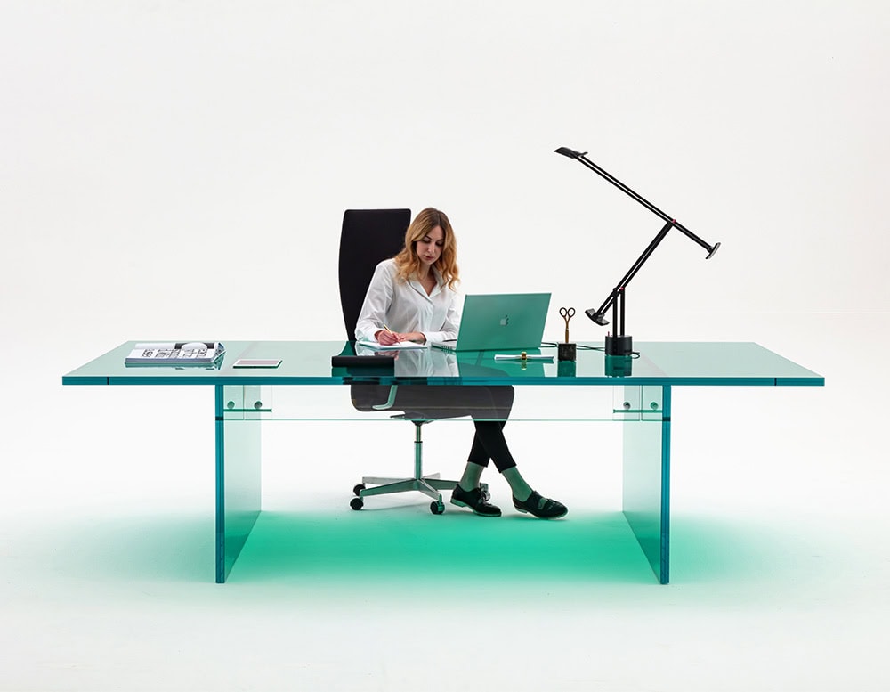 work table made entirely of thick transparent glass on a white background