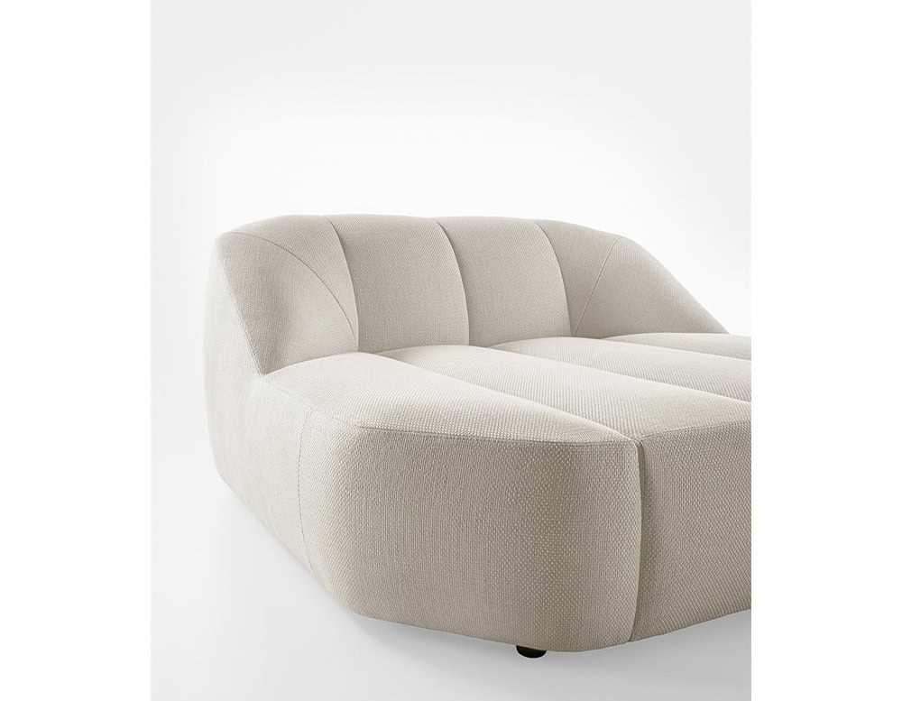 Armchair made of polyurethane foam, wooden base and upholstered in white leather on a white background