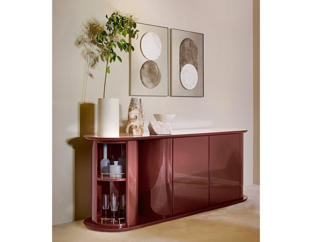 dressing table made of wooden base with circular drawers stained in a bright red wine color tone in a living room