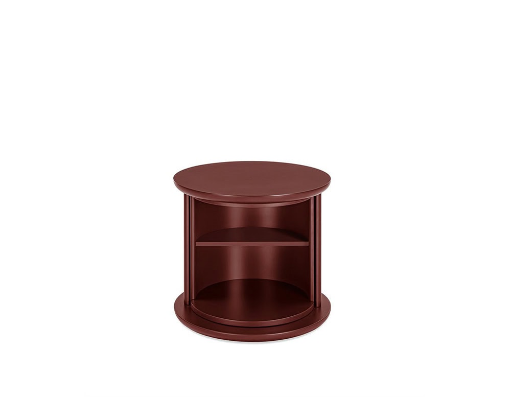 rotating coffee table made in the shape of a cylinder and made of wood in a bright red wine color tone