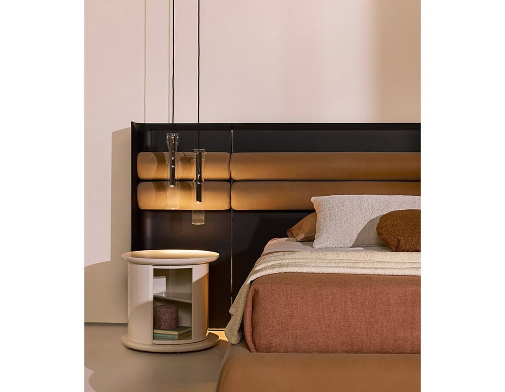 nightstands made of cylinder-shaped wooden base in a light beige tone with rotating drawers in a room