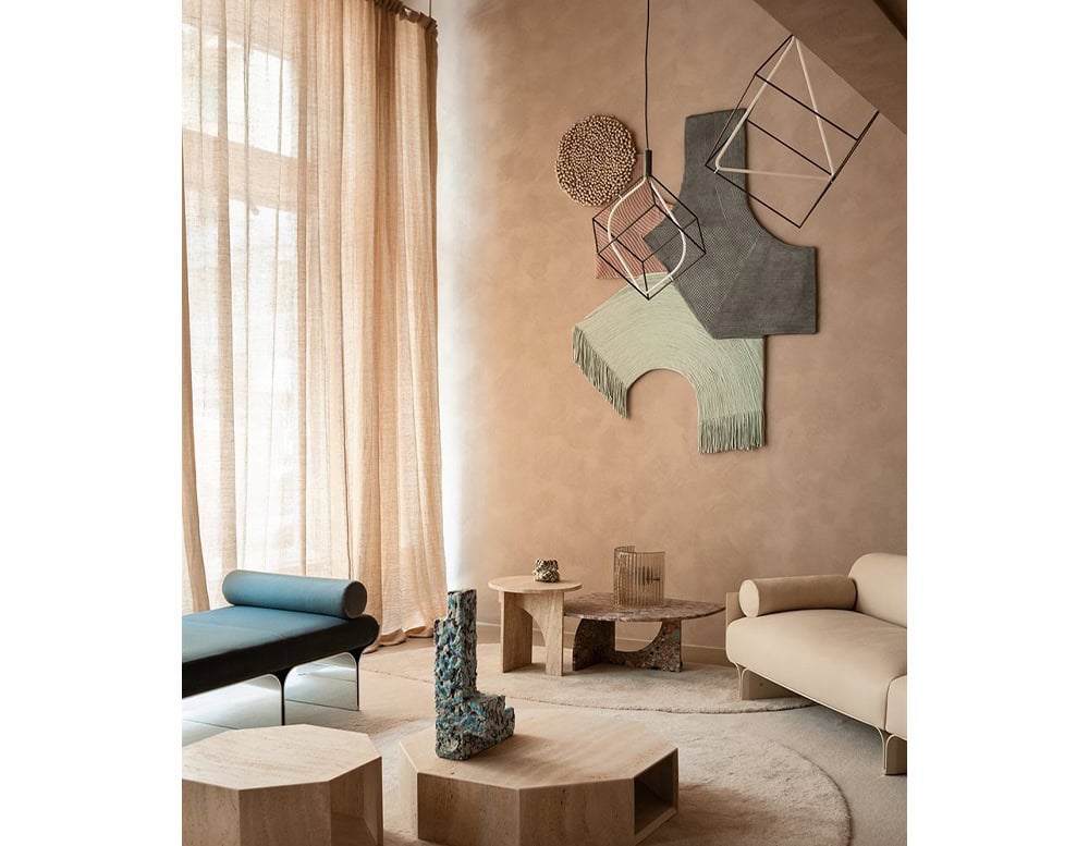 wall tapestry made of different materials and shapes in shades of coffee, green, pink and gray