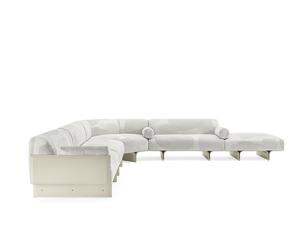 sofa made of curved ash wood base and upholstered in white fabric with a design in gray stains