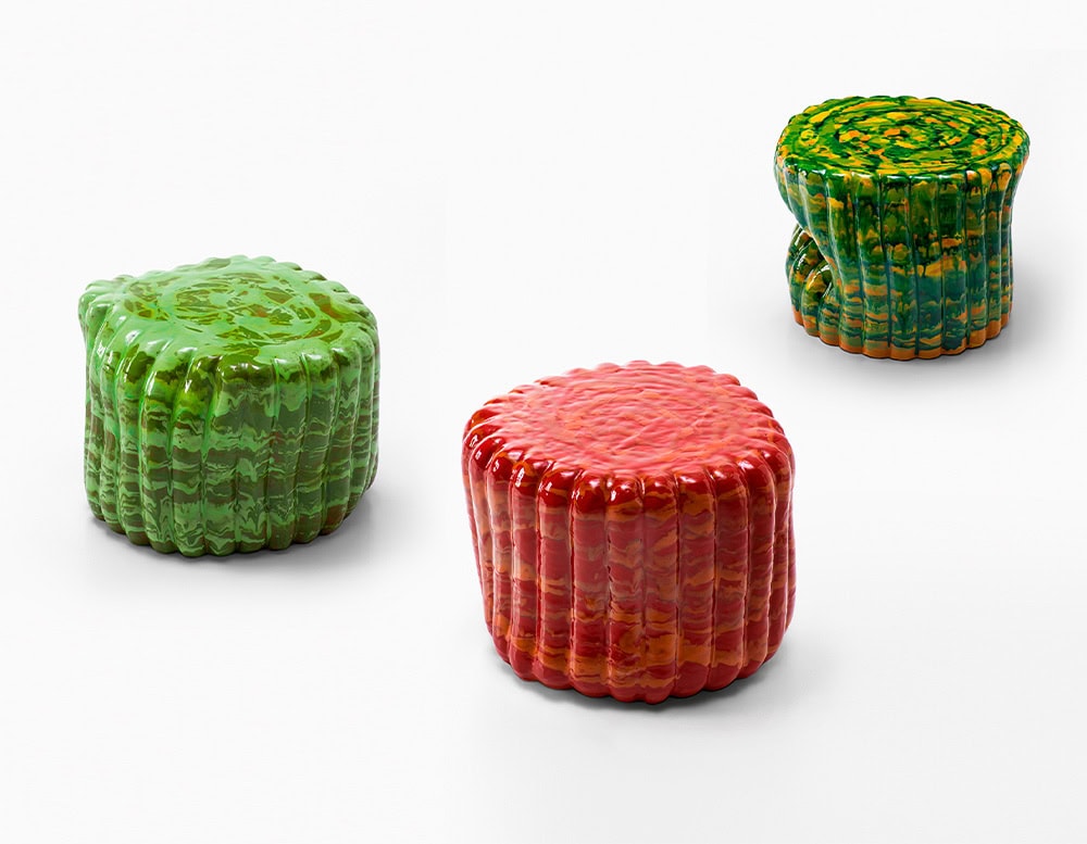 three side tables made of anemone in shades of green with yellow green and red