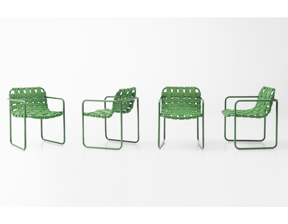 four hand-woven chairs with elastic belts and aluminum base in a dark green tone