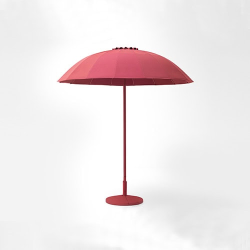 Umbrella with dome-shaped parasol in fabric in a shade of pink on a white background