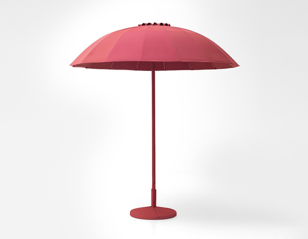 Umbrella with dome-shaped parasol in fabric in a shade of pink on a white background