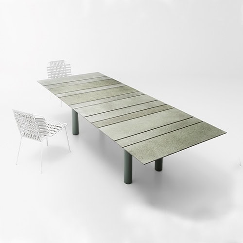 Rectangular dining table made of stainless steel handle and top in different elements in a varnished gray tone