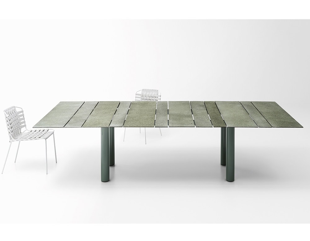 Rectangular dining table made of stainless steel handle and top in different elements in a varnished gray tone on a white background