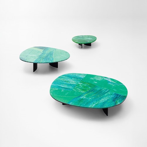 Side tables with Sciara top in a lava stone color tone decorated with glass.