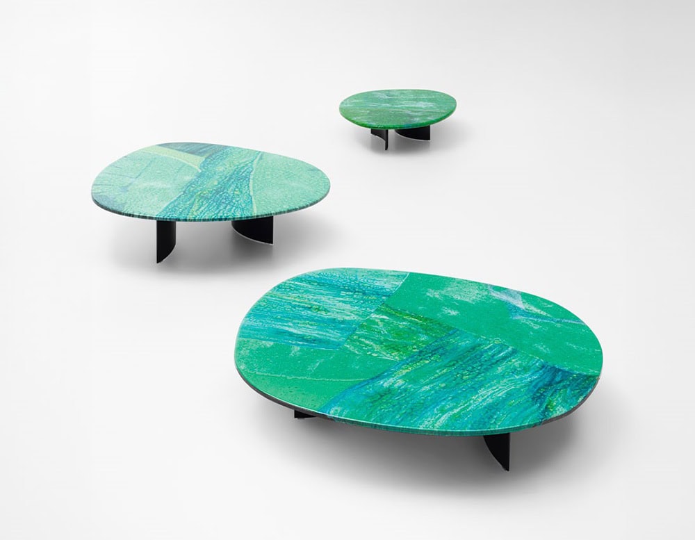 Side tables with Sciara top in a lava stone color tone decorated with glass.