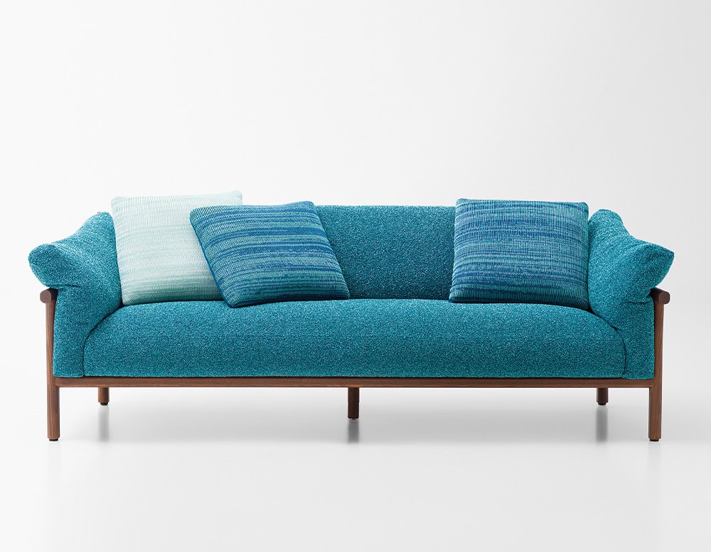 sofa made of brown wood base and foam filling upholstered in aquamarine blue fabric on a white background