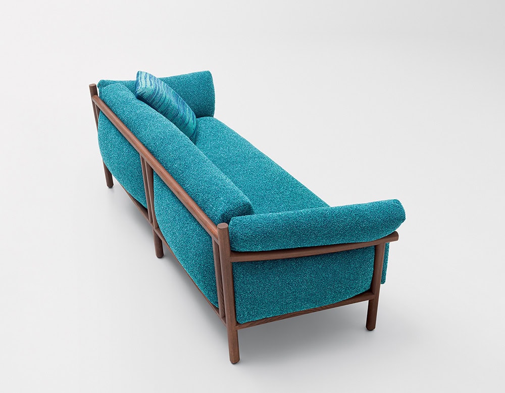 sofa made in its structure of brown wood and upholstered in fabric of a blue color, filled with polyurethane foam