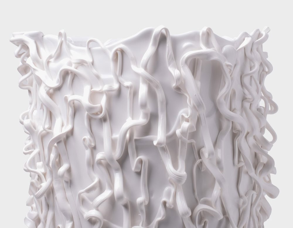 Top part of Medusa Vase White with irregular pattern on a white background.