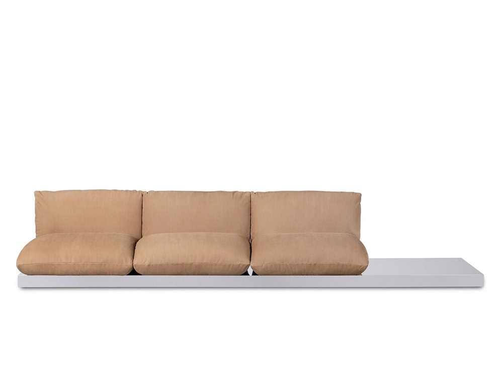 Three seater Aura sofa in brown leather on a white background.