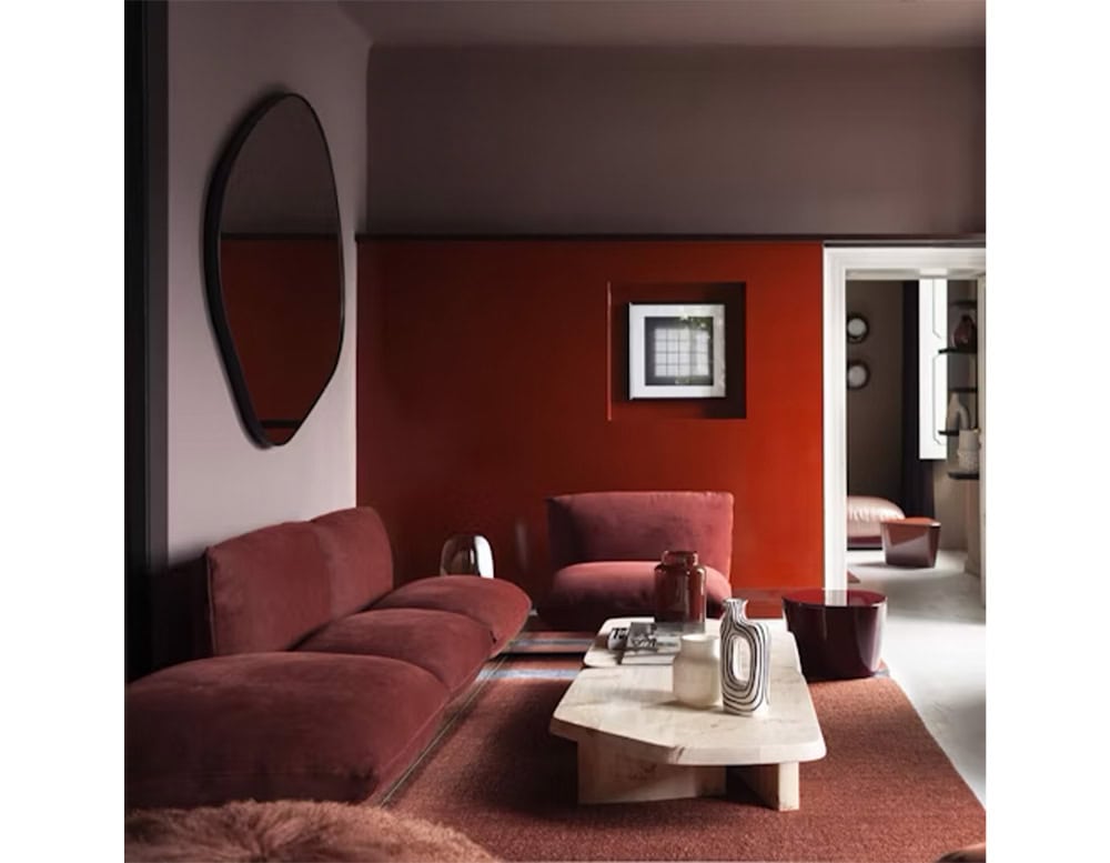 Side view of a Aura brown sofa in a modern living room setting.