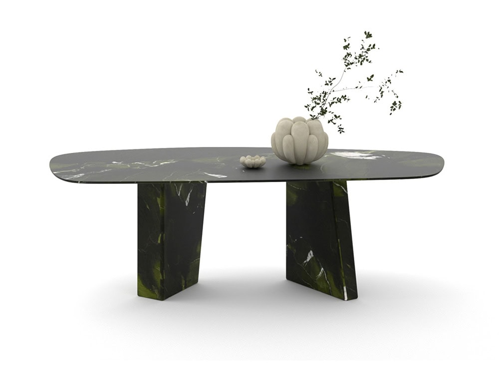 Oval Paramount dining table in black marble with white lines, set against a white background.