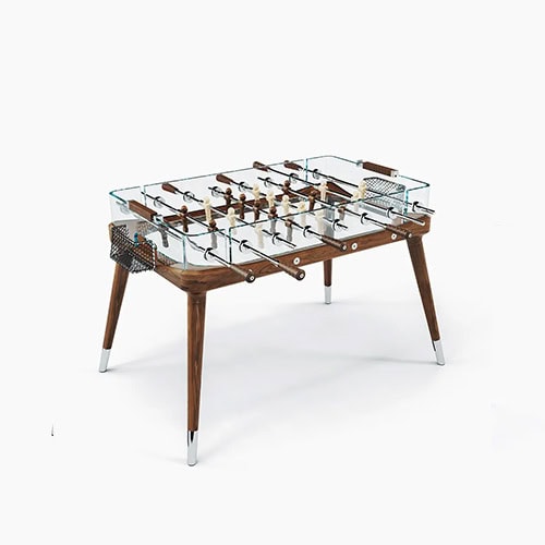 Teck 90 Minuto Classic table in clear glass, brown and silver accesories on a white background.