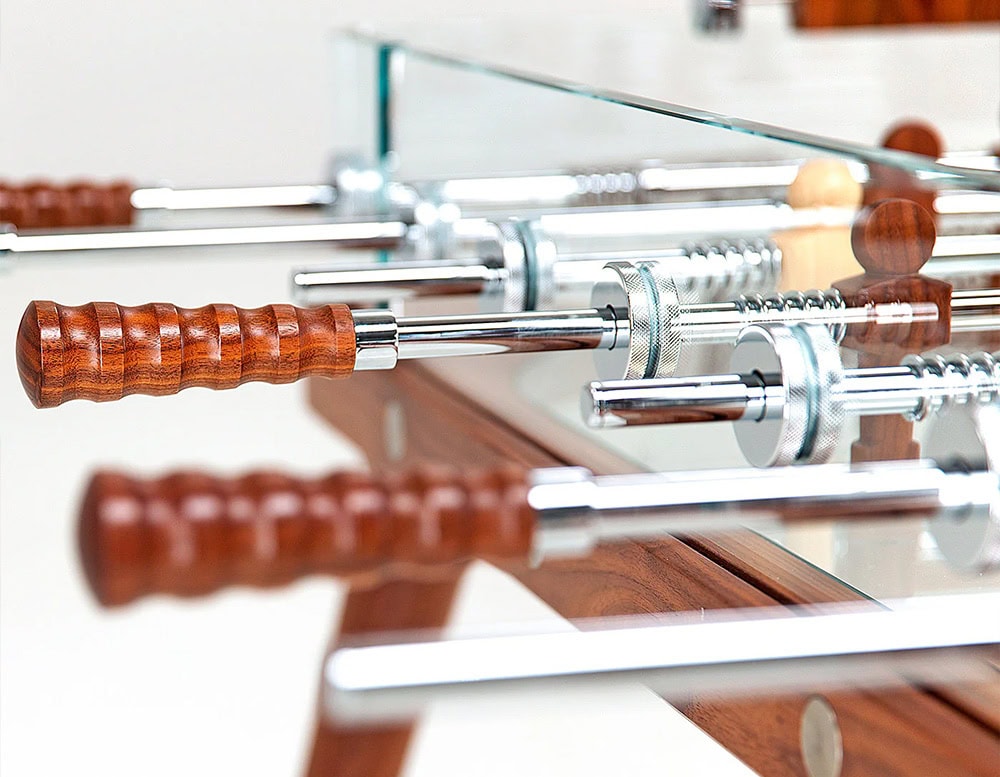 Closeup of Teck 90 Minuto Classic table. Brown and silver accesories on a white background.